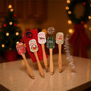 Espátula de silicone com cabo de madeira natalino.