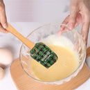 Espátula de silicone com cabo de madeira natalino.